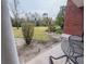 This backyard view from the patio highlights outdoor seating and green space at 7650 Whisper Way # 102, Reunion, FL 34747