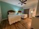 Comfortable bedroom with hardwood floors, a ceiling fan, and a large closet for storage at 7650 Whisper Way # 102, Reunion, FL 34747