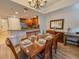 Charming dining room adjacent to kitchen with hardwood floors and plenty of space for entertaining at 7650 Whisper Way # 102, Reunion, FL 34747