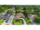 Aerial view of the home showing lush landscaping and a circular driveway at 7846 Snowberry Cir, Orlando, FL 32819