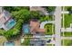 Aerial view of the home, screened-in pool, driveway, and landscaping at 7846 Snowberry Cir, Orlando, FL 32819