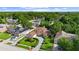Aerial view of the house, showing the surrounding trees and neighborhood at 7846 Snowberry Cir, Orlando, FL 32819