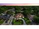 Beautiful two-story home featuring a meticulously landscaped front yard and circular driveway at 7846 Snowberry Cir, Orlando, FL 32819