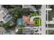 From above, see the inviting pool, manicured lawn, and circular driveway at 7846 Snowberry Cir, Orlando, FL 32819