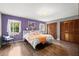 Inviting bedroom with hardwood flooring, large closet, and plenty of natural light at 7846 Snowberry Cir, Orlando, FL 32819