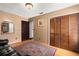Cozy bedroom features wood floors, ample closet space, and a comfortable seating area at 7846 Snowberry Cir, Orlando, FL 32819