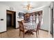 Dining room features a ceiling fan, tile flooring, and a dining table set at 7846 Snowberry Cir, Orlando, FL 32819