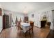 Bright dining room features hardwood floors, a chandelier, and furniture at 7846 Snowberry Cir, Orlando, FL 32819