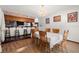 Cozy dining room features a chandelier, wood chairs, and bar access at 7846 Snowberry Cir, Orlando, FL 32819