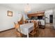 Cozy dining room features a chandelier, wood chairs, and bar access at 7846 Snowberry Cir, Orlando, FL 32819