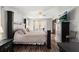Spacious bedroom with a king bed, ceiling fan, ensuite bathroom, and ample closet space at 7846 Snowberry Cir, Orlando, FL 32819