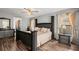 Bright bedroom with a king-sized bed, side tables, and plenty of natural light from the windows at 7846 Snowberry Cir, Orlando, FL 32819