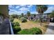 Courtyard view showcasing lush landscaping, tropical palms, and a well-maintained two-story exterior at 7900 S Orange Blossom Trl # 2102, Orlando, FL 32809