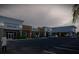 A new commercial construction exterior with storefronts, parking lot and covered sidewalk at 7900 S Orange Blossom Trl # 2102, Orlando, FL 32809