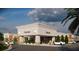 A new commercial construction exterior with storefronts, parking lot, and covered sidewalk at 7900 S Orange Blossom Trl # 2102, Orlando, FL 32809