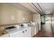Image of a laundry room with multiple washing machines and a brick floor at 7900 S Orange Blossom Trl # 2102, Orlando, FL 32809