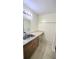 Bathroom vanity with sink, mirror, and ample counter space at 7900 S Orange Blossom Trl # 2102, Orlando, FL 32809