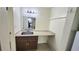 Bathroom vanity with mirror for a compact space at 7900 S Orange Blossom Trl # 2102, Orlando, FL 32809