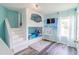 Whimsical bedroom featuring custom bunkbeds with stairs, Frozen themed decor, and a vanity table at 8491 Oasis Key Cv, Kissimmee, FL 34747