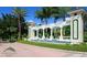 Emerald Island Resort entrance featuring stone pillars, a water feature, and tropical landscaping at 8491 Oasis Key Cv, Kissimmee, FL 34747