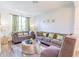 Inviting living room with large window offering ample natural light and comfortable seating at 8491 Oasis Key Cv, Kissimmee, FL 34747