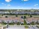 A beautiful townhome community with lush landscaping, sidewalks, and ample parking spaces at 8947 Stinger Dr, Davenport, FL 33896