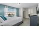 Relaxing bedroom with bright windows, a TV, and access to the bathroom at 8947 Stinger Dr, Davenport, FL 33896
