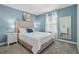 Comfortable bedroom with a queen-sized bed, bright decor, and natural lighting at 8947 Stinger Dr, Davenport, FL 33896
