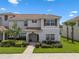 Charming two-story home with lush landscaping and a welcoming front porch at 8947 Stinger Dr, Davenport, FL 33896