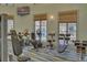 Onsite gym featuring cardio equipment, weight machines, and natural light from the windows at 8947 Stinger Dr, Davenport, FL 33896