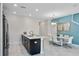 Open-concept kitchen and dining area with modern appliances and marble floors at 8947 Stinger Dr, Davenport, FL 33896