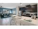 Modern kitchen featuring a breakfast bar with seating and stainless steel appliances at 8947 Stinger Dr, Davenport, FL 33896