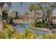 Unwind and enjoy the community's lazy river with scenic landscaping and clear water at 8947 Stinger Dr, Davenport, FL 33896