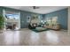 Spacious living room with marble floors, bright windows, and modern furniture at 8947 Stinger Dr, Davenport, FL 33896