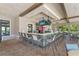 Outdoor bar with seating, perfect for relaxing and socializing with refreshments in a planned community at 8947 Stinger Dr, Davenport, FL 33896
