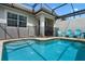 Private pool with lounge chairs at 8947 Stinger Dr, Davenport, FL 33896