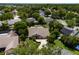 Charming home featuring a well-manicured lawn, mature trees, and inviting outdoor space at 1016 Ohanlon Ct, Oviedo, FL 32765