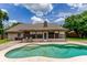 Inviting backyard with a refreshing pool, ample patio space, and a well-maintained lawn at 1016 Ohanlon Ct, Oviedo, FL 32765