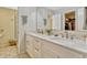 Bright bathroom featuring a double vanity and glass shower with convenient built-in storage at 1016 Ohanlon Ct, Oviedo, FL 32765