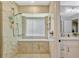 Spacious walk-in shower with glass door and window, in a bathroom with dual vanity at 1016 Ohanlon Ct, Oviedo, FL 32765
