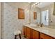 Classic bathroom featuring wallpaper, a cabinet, single vanity, and a stool for seating at 1016 Ohanlon Ct, Oviedo, FL 32765