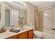 Traditional bathroom with a combination shower and bathtub, along with a decorative vanity at 1016 Ohanlon Ct, Oviedo, FL 32765