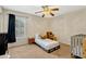 bedroom featuring a crib, toddler bed, plush carpet, and bright natural light at 1016 Ohanlon Ct, Oviedo, FL 32765