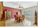 Charming dining room featuring a round table, tile floors, and a window with plantation shutters at 1016 Ohanlon Ct, Oviedo, FL 32765