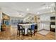 Open-concept kitchen featuring a breakfast bar, white cabinets, and stainless steel appliances at 1016 Ohanlon Ct, Oviedo, FL 32765