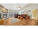 Comfortable living room with a stone fireplace, wood-look flooring, and sliding glass doors at 1016 Ohanlon Ct, Oviedo, FL 32765