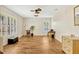 Spacious living room with wood-look floors, plantation shutters, and plenty of natural light at 1016 Ohanlon Ct, Oviedo, FL 32765