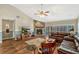 Cozy living room with a stone fireplace, wood-look flooring, and comfortable seating at 1016 Ohanlon Ct, Oviedo, FL 32765