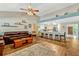 Open concept living space with a kitchen featuring a breakfast bar and a living room with vaulted ceilings at 1016 Ohanlon Ct, Oviedo, FL 32765