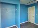 Bedroom closet with a clothes rack, door to the bedroom, and wood-look laminate flooring at 1203 Atlantic Ct, Kissimmee, FL 34759